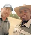  ??  ?? Friedl von Maltitz, 45, and fellow farmer Lehlohonol­o Radebe, 35, on Von Maltitz’s farm last year.