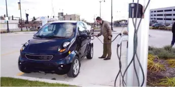  ?? SUN-TIMES FILE ?? Electric vehicle charging stations, like this one at a Skokie CTA station, would become more common in Chicago under a proposal advanced by the City Council’s Zoning Committee on Monday.