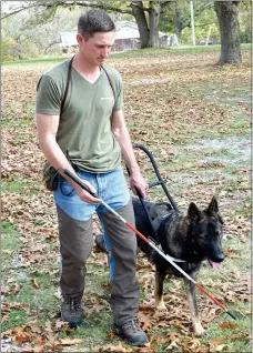  ?? Photo by Mike Eckels ?? Mike Wood, owner of the Ozark Canine Academy in Decatur, puts Low Key through his paces Nov. 2. Low Key, an 18-month-old German Shepherd, was sent to the Decatur facility from California for training as a seeing-eye service dog. By Mike Eckels meckels@nwadg.com