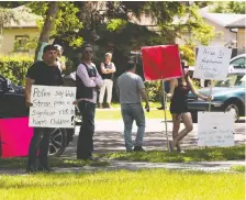  ?? GREG SOUTHAM ?? About 100 people came out to protest at the Edmonton home of the mother of accused kidnapper and child sexual predator Wade Stene last weekend. His lawyer has filed a complaint with police for issuing a news release saying Stene posed a safety risk to children.