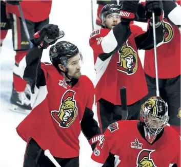  ?? FRED CHARTRAND/THE CANADIAN PRESS ?? Ottawa’s Mark Stone, left, Bobby Ryan, rear, and goalie Craig Anderson celebrate their 2-1 victory over the Pittsburgh Penguins in Game 6 of the Eastern Conference final Tuesday in Ottawa.