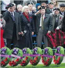  ?? JASON PAYNE/PNG ?? Canadian veterans salute their fallen comrades at Saturday’s Remembranc­e Day ceremony at the cenotaph in Victory Square.