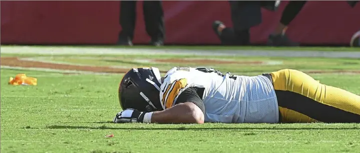  ?? Peter Diana/Post-Gazette ?? Defensive end Cam Heyward had trouble getting up off the field late in the fourth quarter of Sunday’s loss to the 49ers that sent the Steelers to 0-3 on the season.