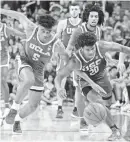  ?? USA TODAY ?? Ethan Anderson and UCLA’s Chris Smith battle.