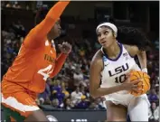  ?? MIC SMITH — THE ASSOCIATED PRESS ?? LSU's Angel Reese, going up against Miami's Kyla Oldacre, had 13points and 18rebounds in the Tigers' victory.