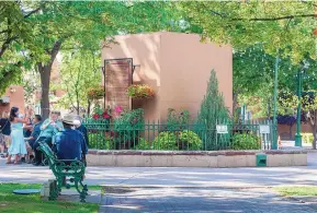  ?? EDDIE MOORE/JOURNAL ?? A box was built to enclose remnants of the Soldiers’ Monument obelisk on the Santa Fe Plaza that protesters pulled down in October 2020. The obelisk’s destructio­n has become an issue in the 2021 mayoral campaign.