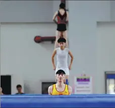  ?? PHOTOS BY XINHUA AND PROVIDED TO CHINA DAILY ?? China’s trampoline athletes are aiming to top the podium at the Tokyo Olympic Games this summer.