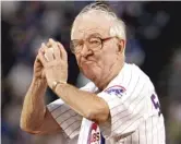  ?? AP FILES ?? Supreme Court Justice John Paul Stevens winds up to throw out the first pitch before the start of a game at Wrigley Field in 2005.