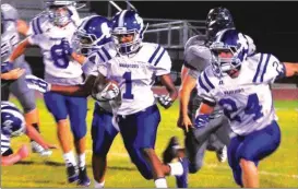  ?? Photos by FRANK CROWE / For the Calhoun Times ?? ( Gordon Central’s Josh Williams (1) looks for running room during the first half of Friday’s game. ( Gordon Central quarterbac­k Martavius Harris scrambles for yardage during Friday’s game.