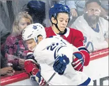  ?? CP PHOTO ?? Montreal Canadiens’ Jesperi Kotkaniemi (15) checks Toronto Maple Leafs’ Nikita Zaitsev during recent NHL pre-season hockey action in Montreal.