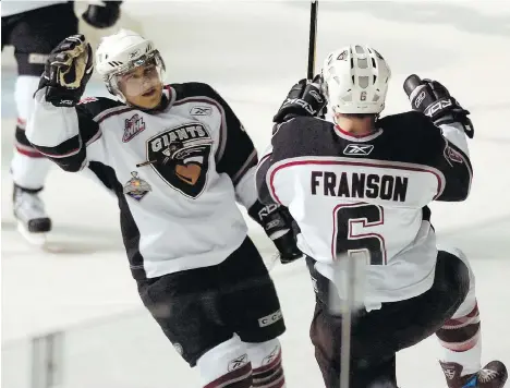  ?? GERRY KAHRMANN/FILES ?? Giants Wacey Rabbit, left, and Cody Franson celebrate a Franson goal in 2007 Memorial Cup action at the Pacific Coliseum. Astute trades such as the one that landed Rabbit have helped the major junior team since its 2001-02 inception, Steve Ewen writes.