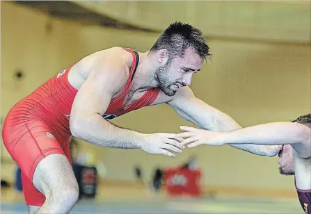  ?? STEPHEN LEITHWOOD BROCK UNIVERSITY ?? Brock University wrestler Ty Bridgwater, left, won a gold medal at the Canada Cup last weekend in Calgary.