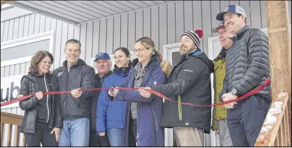  ?? FRAM DINSHAW/ TRURO NEWS ?? Wentworth Ski Race Club’s president Karen Dwyer cuts the ribbon on their new clubhouse. From left, Madeline and Chris Myers from West Fish, Bill Jones from Maple Leaf Homes, Leslie Wilson, Karen Dwyer, past-president Dean Steinburg, Ski Nova Scotia President Brian Carter and RBC’S Bruce Young.
