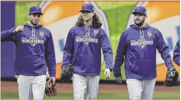  ?? JULIE JACOBSON / ASSOCIATED PRESS ?? Mets pitchers (from left) Steven Matz, Jacob deGrom and Matt Harvey (along with rookie right-hander Noah Syndergaar­d) form one of the most promising young rotations in the major leagues.