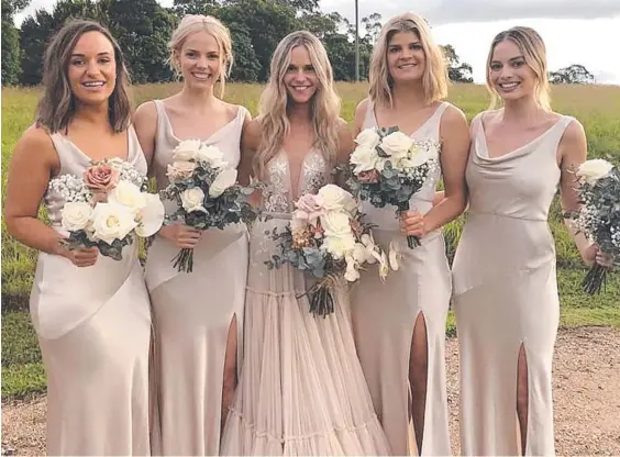  ?? Picture: FACEBOOK / BRITTANY LINDORES ?? Bridesmaid Margot Robbie at the wedding of close friend Anna MacKillop in Byron Bay at the weekend.