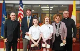  ??  ?? Left to right: Msgr. McCulken, Tom Riley, Anna Patti, Kelly O’Connor, Principal Theresa Healy, and Father Gorka are shown.