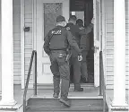  ?? APRIL FISHER/ USA TODAY NETWORK ?? Burlington police enter a house near where three college students of Palestinia­n descent were shot on Saturday.