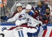  ?? AMBER BRACKEN / THE CANADIAN PRESS ?? Colorado Avalanche teammates Bowen Byram (4), J.T. Compher (37) and Andrew Cogliano (11) celebrate a goal against the Edmonton Oilers in Game 3 of the Western Conference finals.