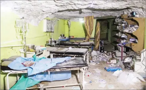  ?? OMAR HAJ KADOUR/AFP ?? A picture taken on April 4, shows destructio­n at a hospital room in Khan Sheikhun, a rebel-held town in the northweste­rn Syrian Idlib province, following a suspected toxic gas attack.