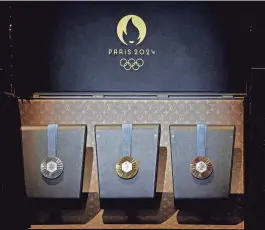  ?? BENOIT TESSIER/REUTERS ?? The medals for the Paris 2024 Olympics are displayed Wednesday. The United States is projected to top the medals table at the Olympics.