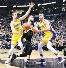  ?? FRANK GUNN/THE CANADIAN PRESS ?? Raptors guard Fred VanVleet (No. 23) drives to the Lakers basket during first half action in Toronto on Sunday. VanVleet scored 25 to pace the Raptors to a 123-111 victory.