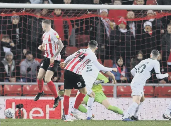  ?? ?? Dan Neil, number 24, fires Sunderland ahead inside the opening five minuntes against Plymouth Argyle at the Stadium of Light.