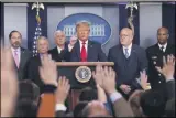  ?? CAROLYN KASTER- ASSOCIATED PRESS ?? In this Feb. 29file photo President Donald Trump, center, points as he prepares to answer question after speaking about the coronaviru­s in the press briefing room at the White House in Washington.