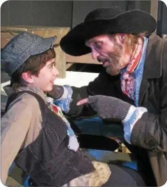  ??  ?? Fagin (DeLarme Landes, right) instructs Oliver (Adam Juraga) in how “to pick a pocket or two” in Actors’ NET of Bucks County’s production of Oliver! Lionel Bart’s beloved musical runs July 12 ñ 28 at the air conditione­d Heritage Center, 635 N. Delmorr...