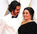  ??  ?? Nominee for Best Supporting Actor ‘Lion’ Dev Patel and his mother Anita arrive on the red carpet.
