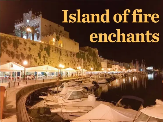  ?? PHOTOS: ALBERT STUMM/THE ASSOCIATED PRESS ?? Diners gather along the shoreline in the city of Ciutadella on the island of Menorca, Spain. The city was the island’s capital until it was destroyed in the 16th century by Turkish invaders.