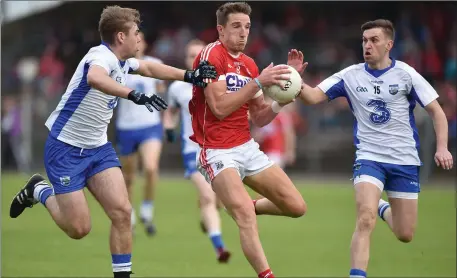  ??  ?? Aidan Walsh in action against Gavin Crotty, right, and Brian Looby of Waterford during last year’s Munster SFC quarter-final at Fraher Field in Dungarvan. The counties meet at the same venue this Sunday in the McGrath Cup but Walsh is unlikely to...