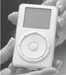  ?? JULIE JACOBSON/ AP ?? The original iPod is displayed after its introducti­on on Oct. 23, 2001.