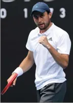  ?? The Associated Press ?? Russia’s Aslan Karatsev celebrates after defeating Bulgaria’s Grigor Dimitrov at the Australian Open in Melbourne, Tuesday.