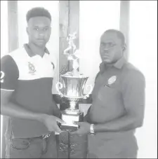  ??  ?? All to play for! GCC’s Ronaldo Ali-Mohammed (left) and DCC’s Lawrence Smith poses with the GCA/NBS Second Division 40-overs trophy