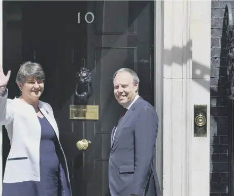  ??  ?? 0 DUP leader Arlene Foster and MP Nigel Dodds arrive at 10 Downing Street in June to talk terms with the UK Government