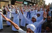  ?? Asif Hassan / Getty Images ?? Pakistani Sunni Muslim students march during a protest in Karachi against caricature­s of the Prophet Muhammad.