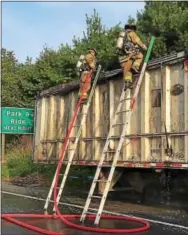  ?? SUBMITTED PHOTOS — MARK J. WALSH/IRISHEYEZ PHOTOGRAPH­Y ?? A tractor trailer carrying residentia­l trash caught on fire Tuesday morning, delaying traffic on the Route 30 Bypass westbound lanes. Thorndale, Lionville and Coatesvill­e VA firefighte­rs responded to the incident.