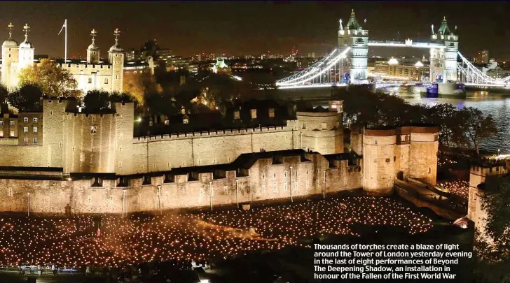  ??  ?? Thousands of torches create a blaze of light around the Tower of London yesterday evening in the last of eight performanc­es of Beyond The Deepening Shadow, an installati­on in honour of the Fallen of the First World War