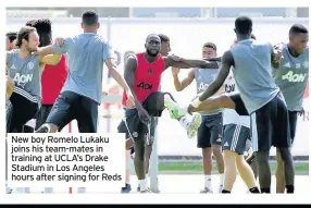  ??  ?? New boy Romelo Lukaku joins his team-mates in training at UCLA’s Drake Stadium in Los Angeles hours after signing for Reds
