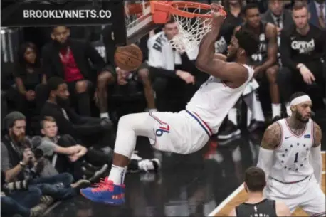  ?? MARY ALTAFFER— THE ASSOCIATED PRESS ?? 76ers center Joel Embiid dunks during the second half of Game 4of a first-round playoff series against the Brooklyn Nets.