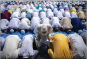  ?? ANUPAM NATH — THE ASSOCIATED PRESS ?? Muslims offer Eid al-Fitr prayers in Gauhati, India, on Tuesday. Eid al-Fitr marks the end of the fasting month of Ramadan.