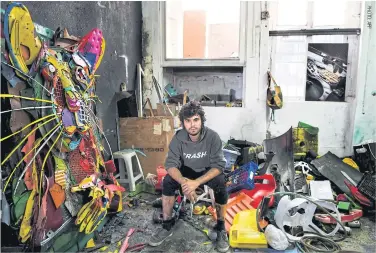  ??  ?? Portuguese artist Artur Bordalo, aka Bordalo II, in his Lisbon studio.