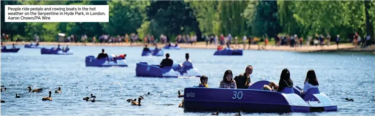  ?? Aaron Chown/pa Wire ?? People ride pedalo and rowing boats in the hot weather on the Serpentine in Hyde Park, in London.