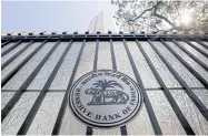 ?? REUTERS ?? The Reserve Bank of India seal is seen on a gate outside RBI headquarte­rs in Mumbai, India.