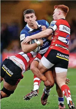  ?? David Davies/pa Wire ?? Bath’s Cameron Redpath is tackled by Gloucester’s Caolan Englefield at the Recreation Ground