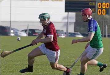  ??  ?? Kyle Firman of St. Martin’s making life difficult for Glynn-Barntown’s David Roche.