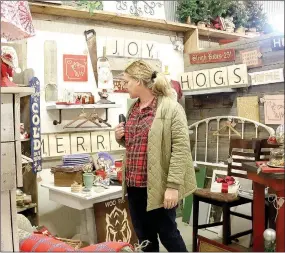  ?? LYNN KUTTER ENTERPRISE-LEADER ?? Bonnie Boyd of Siloam Springs shops at Daisies and Olives during its 20th anniversar­y open house on Dec. 9.