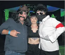 ?? PHOTO: LINDA ROBERTSON ?? Rock ’n’ roll . . . Dressed as their favourite dead rock stars at the Fairfield Community Hall on Saturday are (from left) Danny Hailes, as Ray Sawyer (Dr Hook), Lisa Wong, as TLC’s Lisa (Left Eye) Lopes and Hollie Taylor, as Michael Jackson.