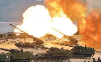  ?? AFPPIX ?? This undated picture released by KCNA news agency on Wednesday shows the North Korean People’s Army performing a combined fire demonstrat­ion during its 85th founding anniversar­y celebratio­ns.