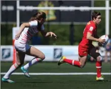  ?? CANADIAN PRESS FILE PHOTO ?? Ghislaine Landry looks for an opening against England in quarter-final action at the HSBC Canada Women’s Sevens in Langford, B.C., in May.